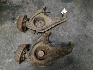 Used Rear wishbone, left Daihatsu Cuore (L251/271/276) 850,Domino Price on request offered by Autodemontage Joko B.V.