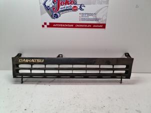 Used Grille Daihatsu Cuore (L251/271/276) 850,44 Price on request offered by Autodemontage Joko B.V.