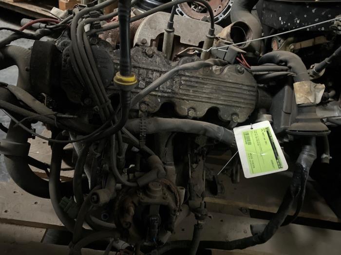 Motor van een Opel Kadett E (33/34/43/44) 1.4 i L,LS,GL 1991