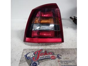 Used Taillight, left Opel Astra G (F08/48) 1.6 16V Price on request offered by Autodemontage Joko B.V.