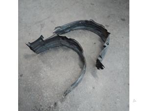 Used Wheel arch liner Daihatsu Cuore (L251/271/276) 1.0 12V DVVT Price on request offered by Autodemontage Joko B.V.