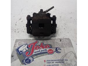 Used Front brake calliper, right Daihatsu Cuore (L251/271/276) 1.0 12V DVVT Price on request offered by Autodemontage Joko B.V.