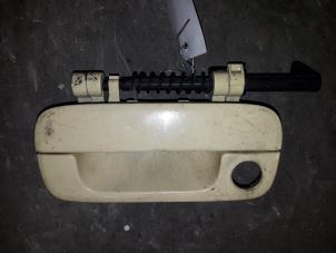 Used Tailgate handle Peugeot Partner 1.9 D Price on request offered by Autodemontage Joko B.V.