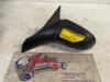 Wing mirror, left from a Opel Corsa B (73/78/79) 1.2i 16V 2000