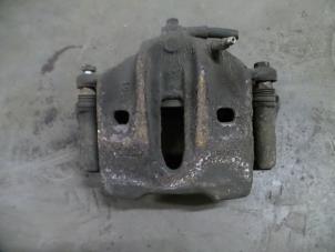Used Front brake calliper, left Opel Omega B (25/26/27) 2.0 DTi 16V Price on request offered by Autodemontage Joko B.V.