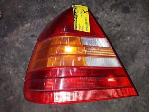 Used Taillight, left Mercedes C (W202) 1.8 C-180 16V Price on request offered by Autodemontage Joko B.V.