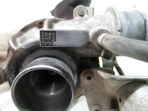 Turbo van een Mazda 323 Fastbreak (BJ14) 2.0 DTiD 16V 1999