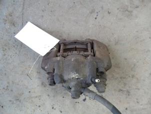Used Front brake calliper, right Daihatsu Cuore (L251/271/276) 1.0 12V Price on request offered by Autodemontage Joko B.V.
