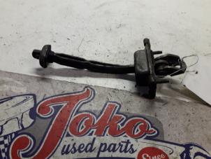Used Door stop 2-door, right Ford Focus 1 1.8 16V Price on request offered by Autodemontage Joko B.V.