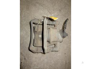 Used Front brake calliper, left Opel Tigra Twin Top 1.4 16V Price on request offered by Autodemontage Joko B.V.