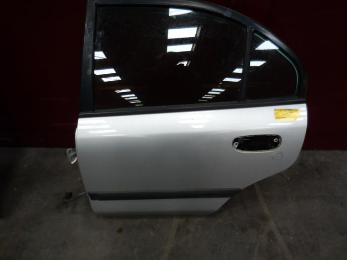 Rear door 4-door, left from a Mitsubishi Carisma 1.8 GDI 16V 2000