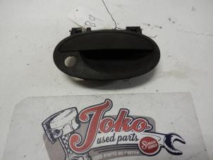 Used Door handle 2-door, right Opel Corsa C (F08/68) 1.0 12V Price on request offered by Autodemontage Joko B.V.