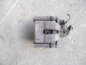 Used Rear brake calliper, left Renault Scénic II (JM) 1.6 16V Price on request offered by Autodemontage Joko B.V.