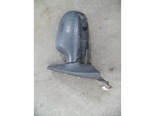 Used Wing mirror, left Daihatsu Cuore (L251/271/276) 1.0 12V Price on request offered by Autodemontage Joko B.V.