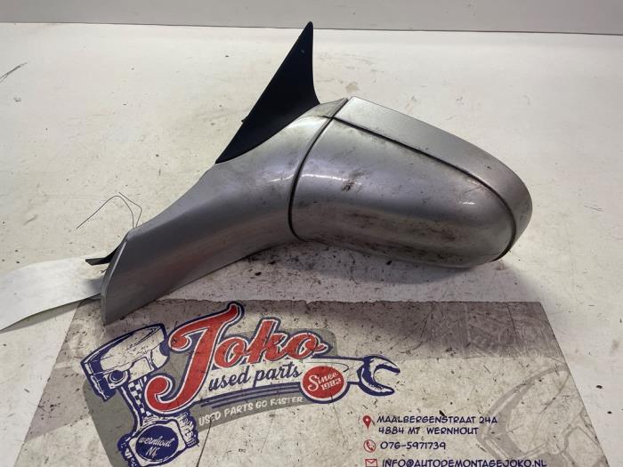 Wing mirror, left from a Opel Corsa B (73/78/79) 1.2i 16V 2000