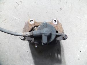 Used Front brake calliper, right Opel Corsa D 1.4 16V Twinport Price on request offered by Autodemontage Joko B.V.