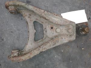 Used Front lower wishbone, left Renault Express Price on request offered by Autodemontage Joko B.V.