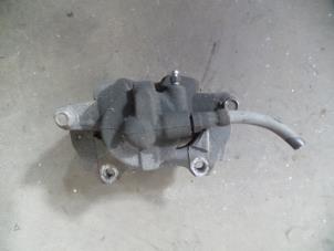 Used Front brake calliper, right Opel Corsa D 1.0 Price on request offered by Autodemontage Joko B.V.