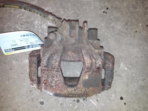 Used Front brake calliper, right Peugeot 306 (7A/C/S) 1.9 D,XND,XAD Price on request offered by Autodemontage Joko B.V.