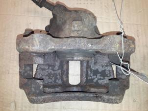 Used Front brake calliper, left Volkswagen Caddy II (9K9A) 1.9 SDI Price on request offered by Autodemontage Joko B.V.