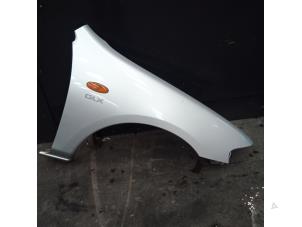 Used Front wing, right Mazda 323 (BA12) 1.5i 16V Price on request offered by Autodemontage Joko B.V.