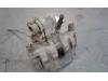 Rear brake calliper, left from a Ford Transit Connect 1.8 TDCi 90 2010