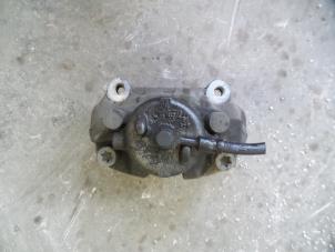 Used Front brake calliper, left Saab 9-3 II (YS3F) 2.0t 16V Price on request offered by Autodemontage Joko B.V.