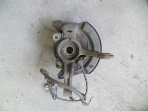 Used Knuckle, front left Daihatsu Cuore (L251/271/276) 1.0 12V DVVT Price on request offered by Autodemontage Joko B.V.