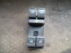 Electric window switch from a Volkswagen Passat (3C2) 2.0 TDI 16V 140 2009
