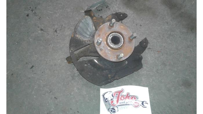 Knuckle, front right from a Mazda MX-3 1.6i 16V 1998