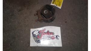 Engine mount from a Mazda MX-3 (EC) 1.6i 16V 1998