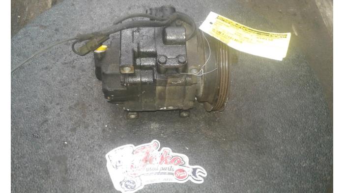 Air conditioning pump from a Mazda MX-3 1.6i 16V 1998