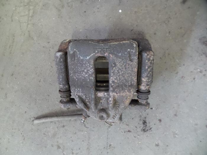 Front brake calliper, left from a Nissan Micra (K12) 1.2 16V 2010