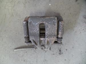 Used Front brake calliper, left Nissan Micra (K12) 1.2 16V Price on request offered by Autodemontage Joko B.V.