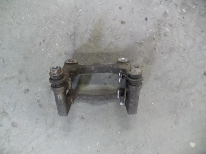 Rear brake calliperholder, right from a Ford S-Max (GBW) 1.8 TDCi 16V 2008