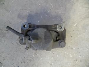 Used Front brake calliper, right Mitsubishi Colt (CJ) 1.3 16V Price on request offered by Autodemontage Joko B.V.