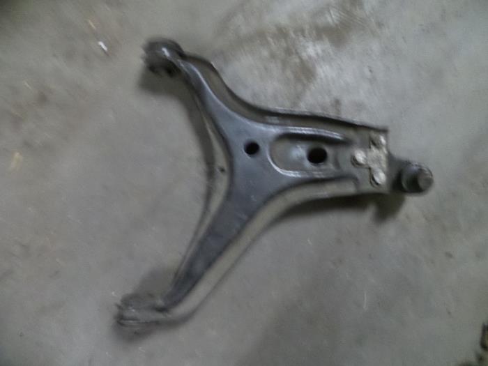 Front lower wishbone, left from a Audi 100 1989