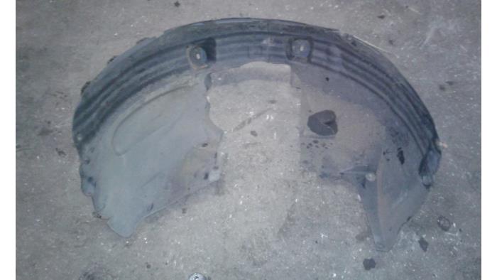 Wheel arch liner from a Opel Corsa D 1.2 16V 2010