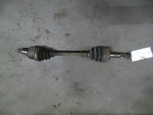 Used Front drive shaft, left Daihatsu Cuore (L251/271/276) 850,Domino Price on request offered by Autodemontage Joko B.V.