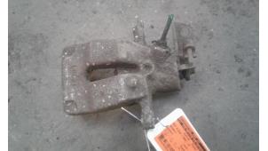 Used Rear brake calliper, left Renault Scénic I (JA) 1.8 16V Price on request offered by Autodemontage Joko B.V.