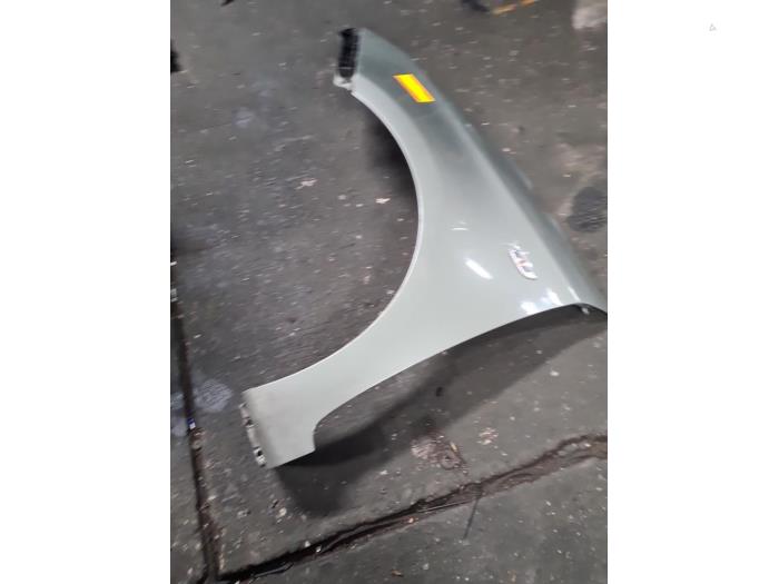 Front wing, left from a Kia Carens IV (RP) 1.6 GDI 16V 2014