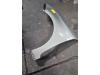 Front wing, left from a Kia Carens IV (RP) 1.6 GDI 16V 2014
