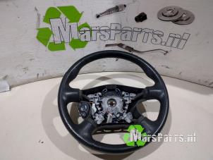 Used Steering wheel Nissan Almera (N16) 1.5 16V Price € 25,00 Margin scheme offered by Autodemontagebedrijf De Mars