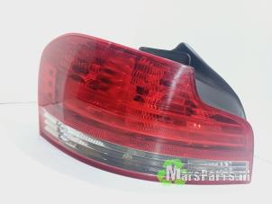 Used Taillight, left BMW 1 serie (E88) 118d 16V Price € 100,00 Margin scheme offered by Autodemontagebedrijf De Mars
