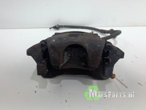 Used Front brake calliper, left Nissan Pixo (D31S) 1.0 12V Price € 30,00 Margin scheme offered by Autodemontagebedrijf De Mars
