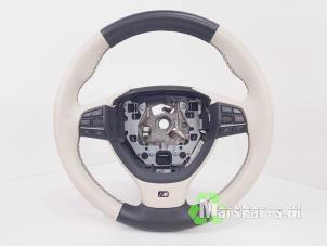 Used Steering wheel BMW 7 serie (F01/02/03/04) 740d xDrive 24V Price € 150,00 Margin scheme offered by Autodemontagebedrijf De Mars