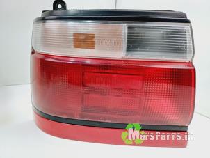 Used Taillight, left Toyota Corolla (E10) 1.6i 16V Price € 65,00 Margin scheme offered by Autodemontagebedrijf De Mars