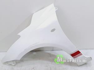 Used Front wing, left Suzuki Swift (ZA/ZC/ZD) 1.2 16V Price € 180,00 Margin scheme offered by Autodemontagebedrijf De Mars