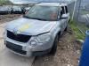 Metal cutting part left front from a Skoda Yeti (5LAC) 2.0 TDI 16V 4x4 2012