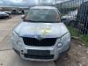 Metal cutting part left front from a Skoda Yeti (5LAC) 2.0 TDI 16V 4x4 2012